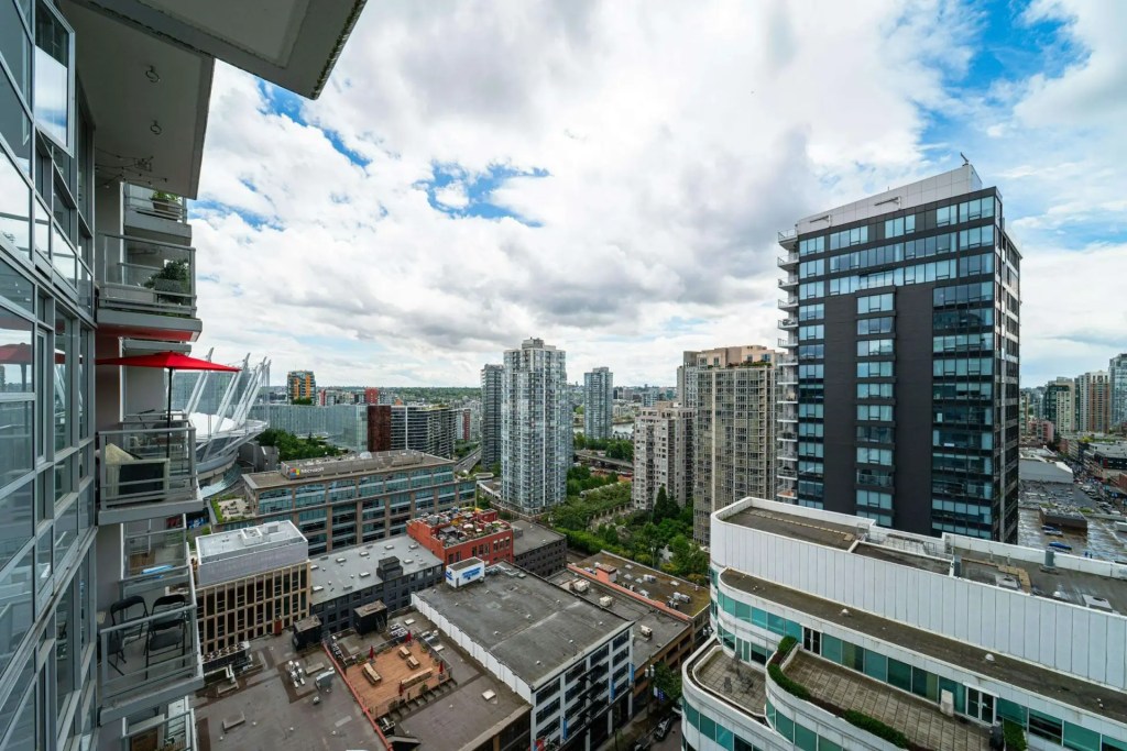 Downtown Vancouver condo towers viewed from a high-rise balcony